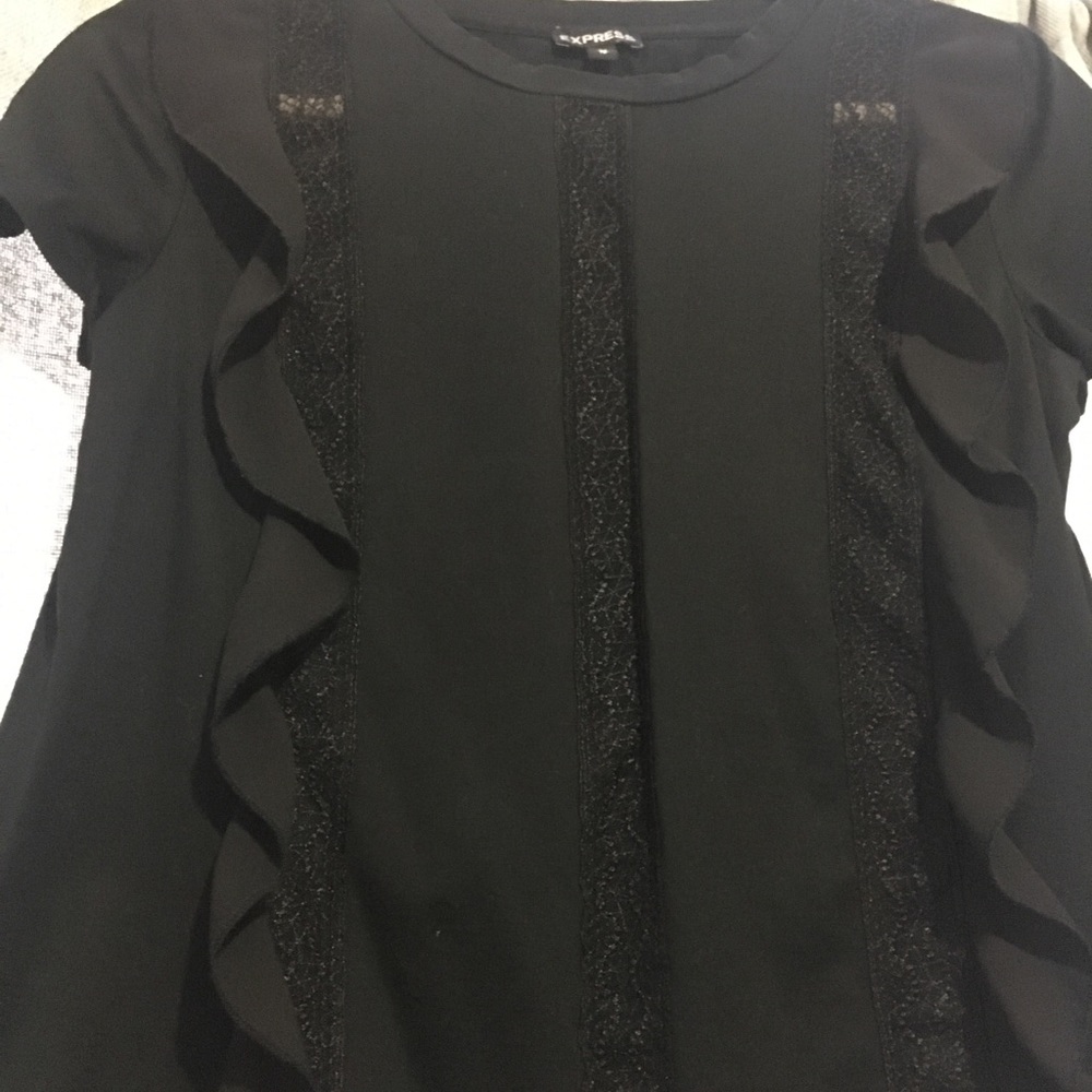 Black T-shirt with ruffle details.
